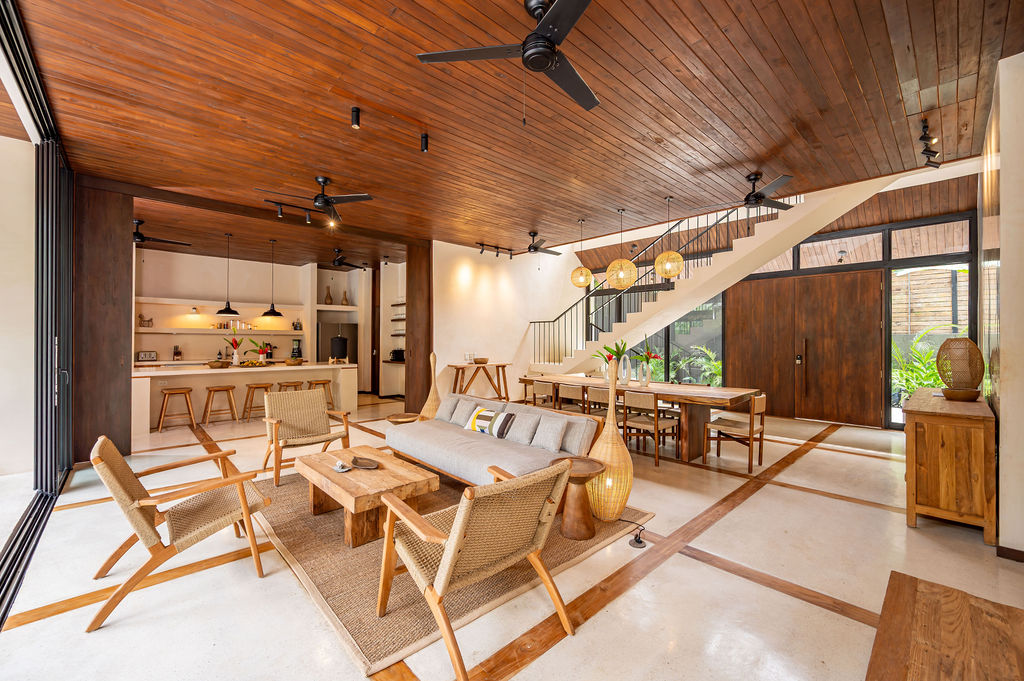 Reverse angle of the great room showing the full sweep of the teak ceiling