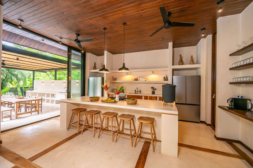 The kitchen island looking out toward the pergola